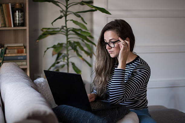 istock Young female freelancer working from home on her laptop computer. 2245190209