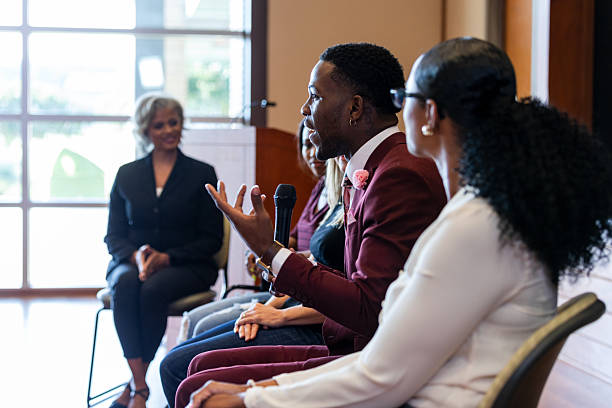istock Diverse group engaged in a lively discussion during a meeting or presentation 2245193668
