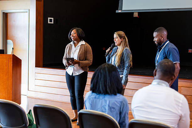 istock Diverse group presenting information, sharing ideas and expertise during an indoor meeting. 2245193701