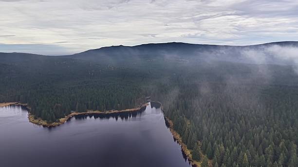 istock Capturing morning environment with vapor and tranquil waters 2245197841