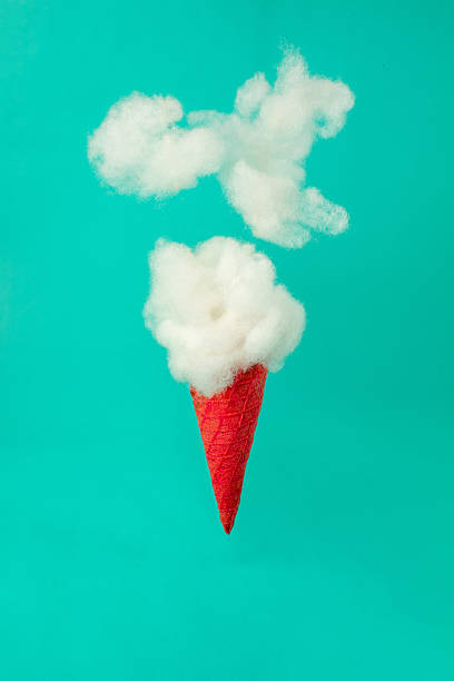 istock Clouds emerging from a red ice cream cone on a vibrant blue background. Growth, future, development concept. Minimal futuristic composition. 2245198518