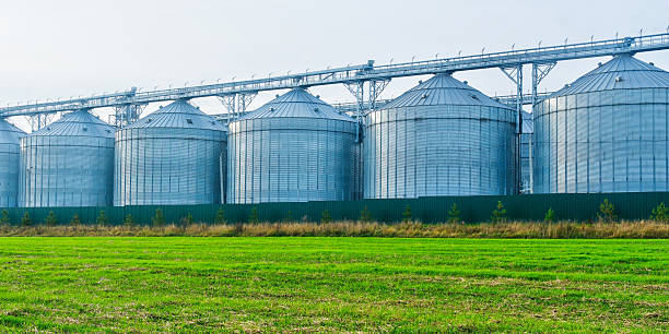 istock Grain silos storing agricultural harvest on a farm field 2245201988