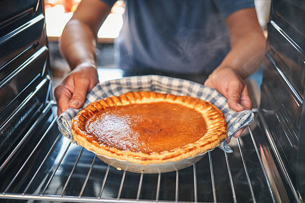istock Preparing Pumpkin Pie for the Holidays in Domestic Kitchen 2245204148