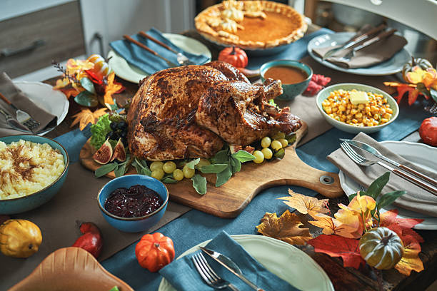 istock Having Stuffed Turkey for Thanksgiving Holiday Dinner with Vegetables and Gravy 2245204194