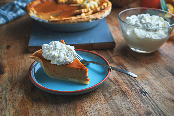 Fresh Baked Pumpkin Pie with Whipped Cream for the Holidays