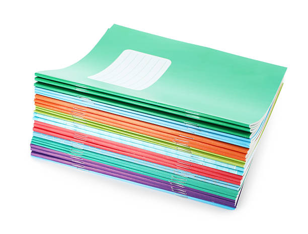 istock Stack of colorful copybooks isolated on white 2245205743