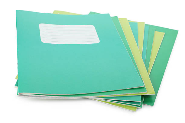 istock Stack of colorful copybooks isolated on white 2245205757