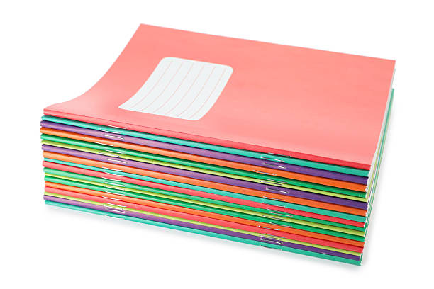 Stack of colorful copybooks isolated on white