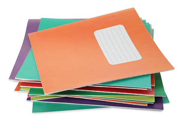 istock Stack of colorful copybooks isolated on white 2245205796