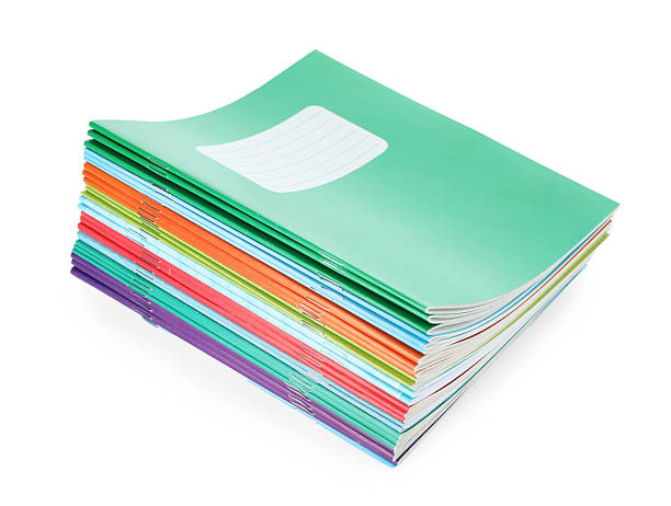 istock Stack of colorful copybooks isolated on white 2245205797