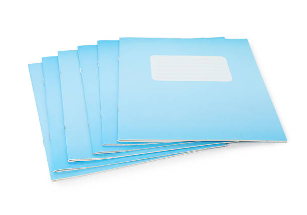 istock Light blue copybooks isolated on white. School stationery 2245205811