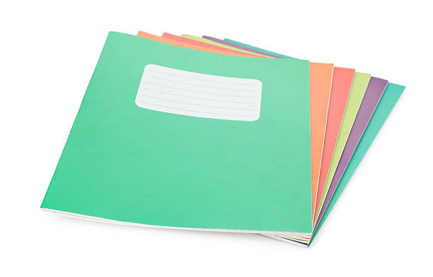 istock Stack of colorful copybooks isolated on white 2245205822