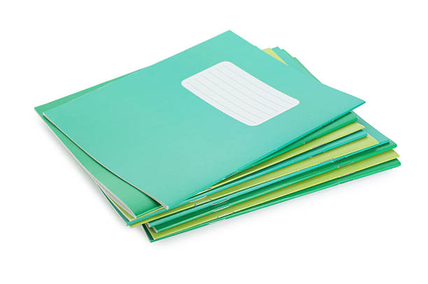 istock Stack of colorful copybooks isolated on white 2245205845