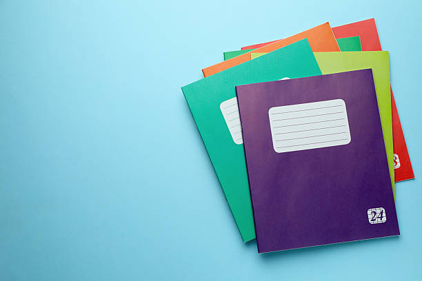 istock Colorful copybooks on light blue background, top view. Space for text 2245205888