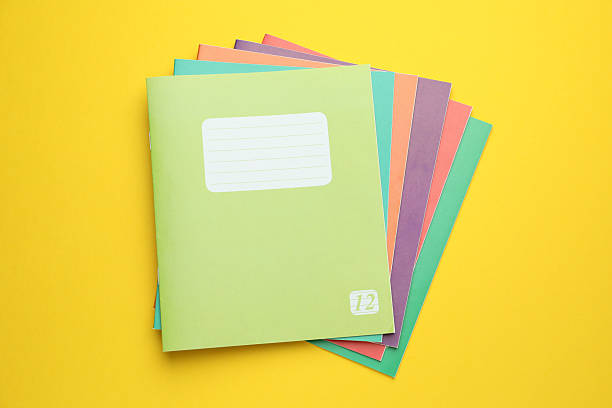 istock Colorful copybooks on yellow background, top view 2245205907