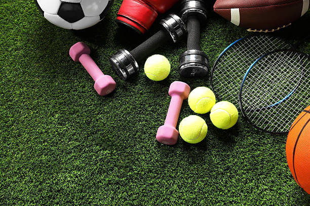 istock Different sports equipment on artificial grass, flat lay. Space for text 2245205967