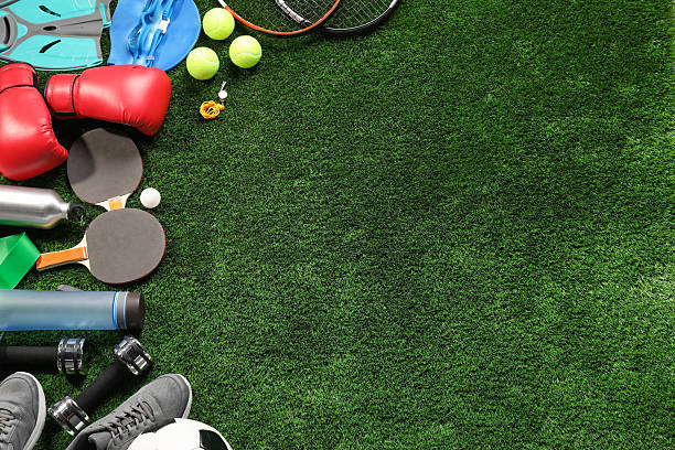 istock Different sports equipment on artificial grass, flat lay. Space for text 2245206022