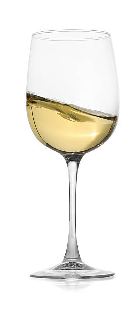istock Tasty wine splashing in glass on white background 2245207681
