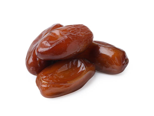 istock Tasty sweet dried dates isolated on white 2245207727