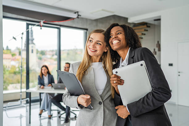 istock Diverse businesswomen collaborating and discussing during office meeting 2245210575