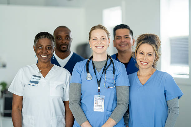 istock Diverse Team Of Doctors And Nurses Smiling Together In Modern Clinic Setting 2245213224