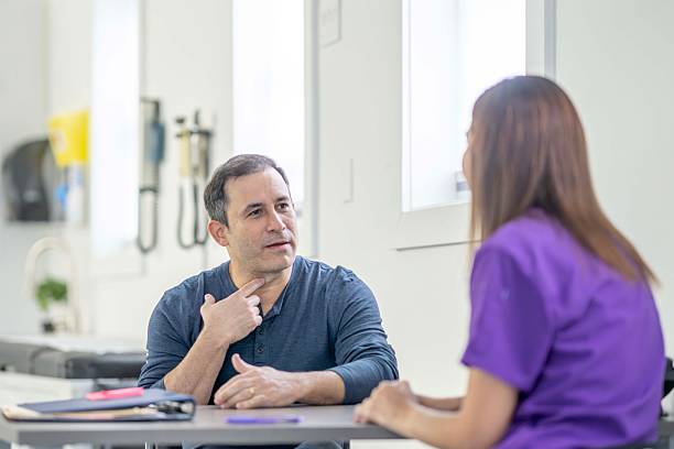 Casual Conversation Between A Patient And Nurse In A Modern Clinic Setting