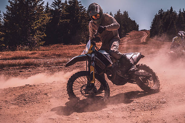 istock A motocross rider's adventure on a sunlit trail 2245214252