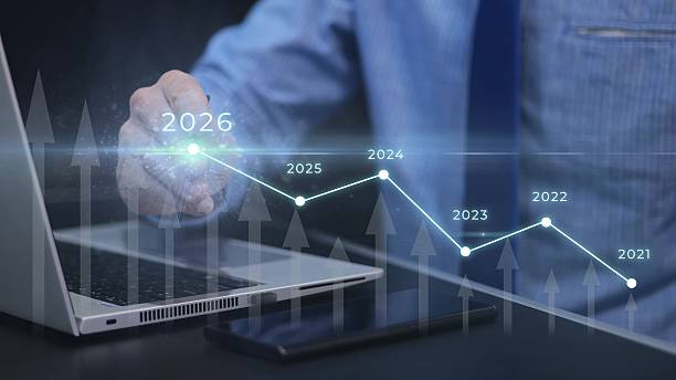 istock Businessman using pen on touchscreen to present growth charts and predict increased sales in 2026 2245214254