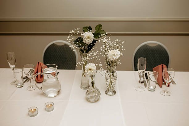 The table for guests in the restaurant is decorated with flowers and candles