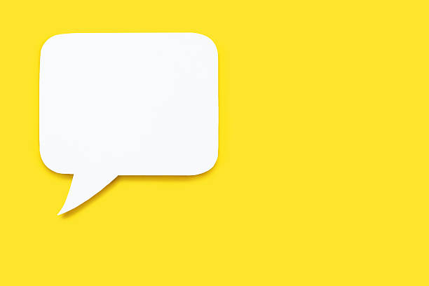 Paper speech bubble in the shape of a rectangle on a yellow background. Flat white chat icon in the form of an empty speech bubble. Free space for text or image. Internet communication concept