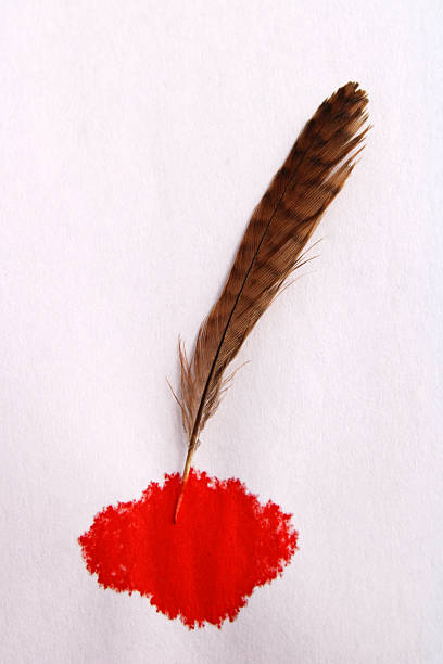 A bird's feather leaves a red ink stain