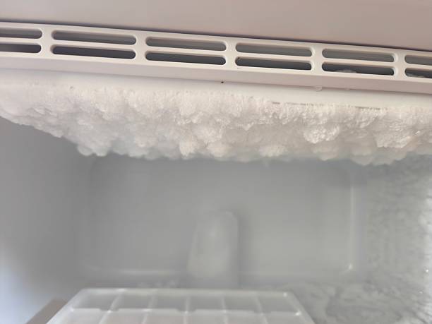 istock Thick Layer of Ice and Frost Build-Up Inside Freezer Compartment: Defrosting Required for Refrigerator Unit Showing Heavy Ice Formations 2245220551