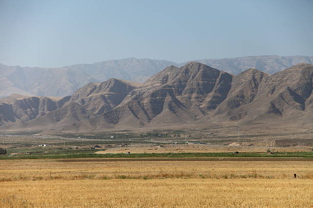 istock Markau Mountain near Ashgabat with arid valley, dry hills and sparse trees under clear blue sky. g 2245221230