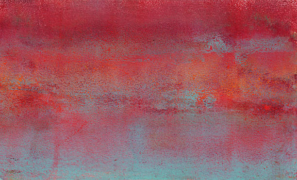 Abstract hand painted background with grunge effect and prominent colors of red and blue.