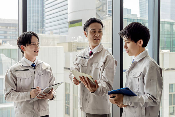 istock Group of Asian people in work clothes working in an office 2245226010