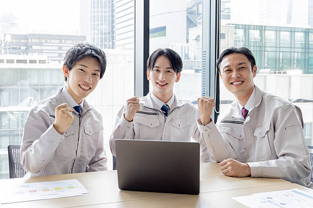 istock Group of Asian people in work clothes working in an office 2245226951