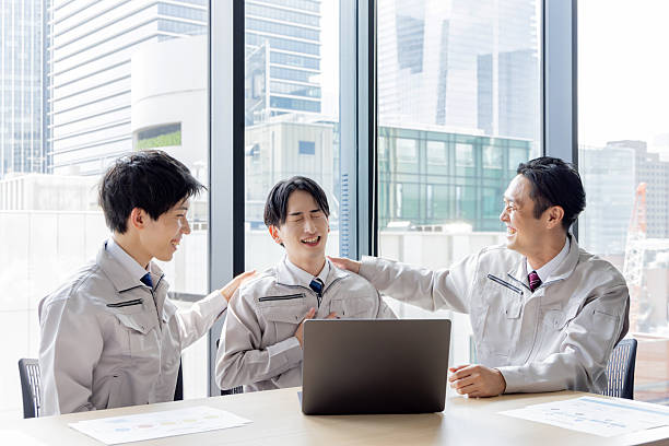istock Group of Asian people in work clothes working in an office 2245227081