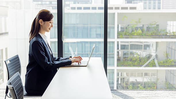 istock Asian businesswoman using a laptop 2245227306
