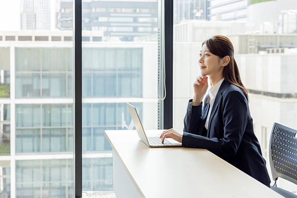 istock Asian businesswoman using a laptop 2245227327