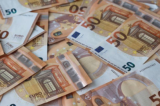 istock Stack of fifty euro banknotes close up 2245227717