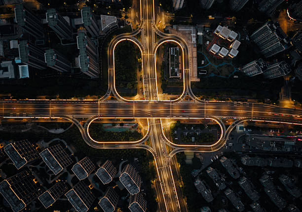 istock Aerial view captures bustling highway interchange illuminated at night in an urban landscape 2245237390