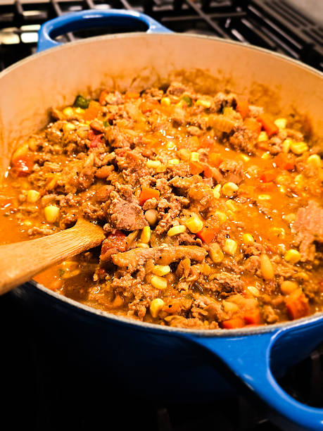 istock Ground Beef and Vegetable Stew Simmering in Blue Dutch Oven 2245240837
