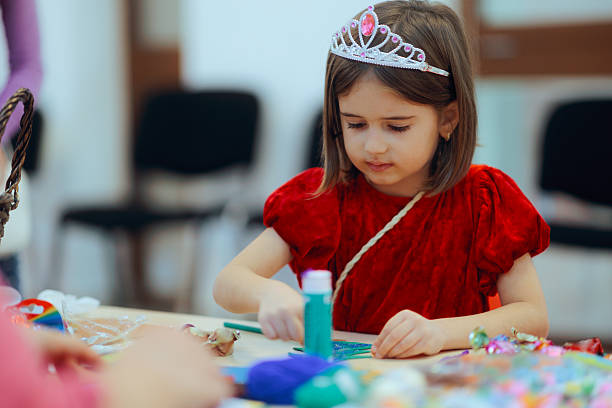 istock Little Girl Participating in an Arts and Craft Workshop 2245241481