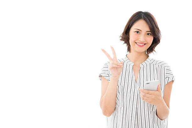 istock Asian businesswoman making a peace sign 2245242700