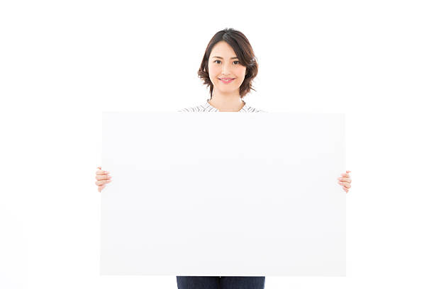istock Asian businesswoman holding a message board 2245242788