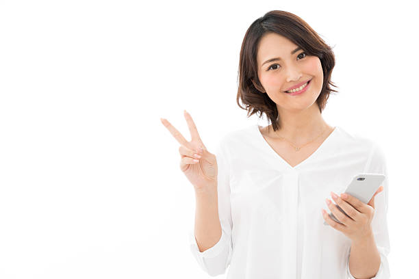 istock Asian woman making a peace sign 2245243599