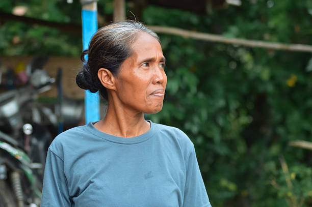 istock Mother turning her head sideways while standing for a portrait outdoors 2245245244