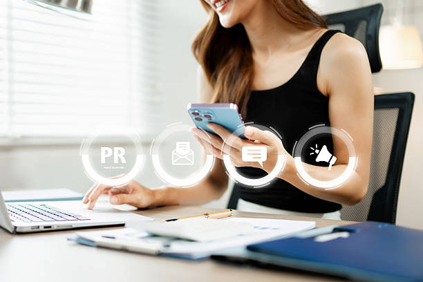 istock PR, Public relations concept. hands using laptop and tablet with public relations icon for communication advertising marketing strategy. with Ads and sales 2245245404