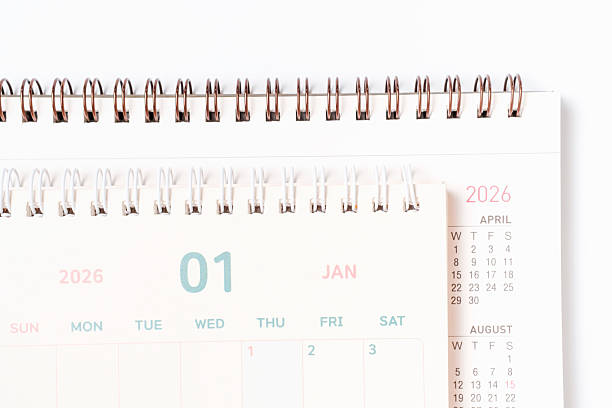 istock Paper calendars for 2026 on white background close-up top view. 2245245852