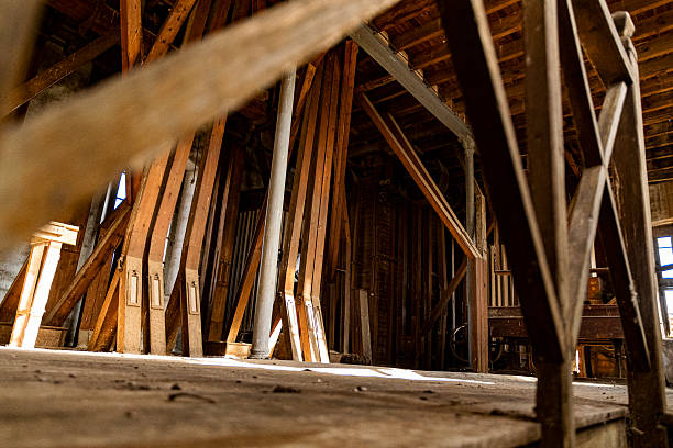 istock Industrial wooden interior featuring exposed beams and rustic atmosphere in an old workshop 2245251119